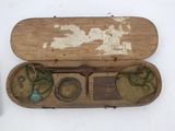 a wooden box with a pair of glasses inside of it