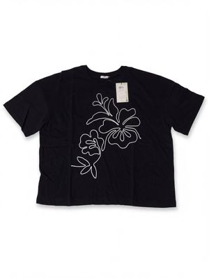 a black t - shirt with white flowers on it