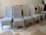 many chairs that are lined up in a room