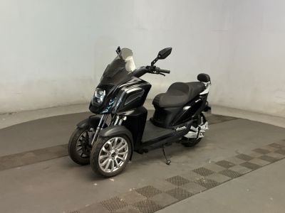 a scooter that is parked inside of a building