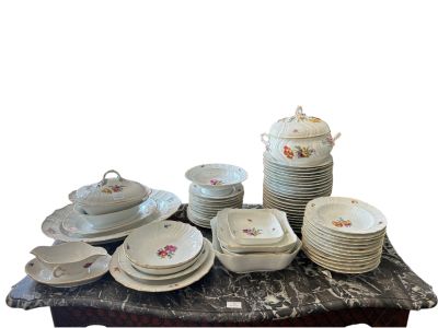 a lot of plates and bowls on a table