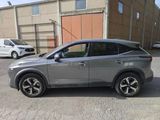 a silver car parked in front of a building