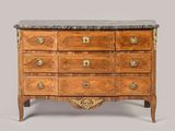 an antique chest of drawers with marble top and brass handles