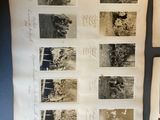 several old photographs of people and animals are on a table