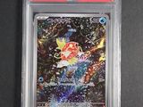 a close up of a pokemon card on a black surface