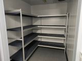 a large open shelving with shelves in a room