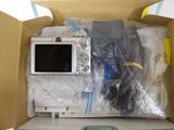 a box with a digital camera inside of it