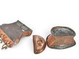 two old copper pots with handles and handles on a white surface