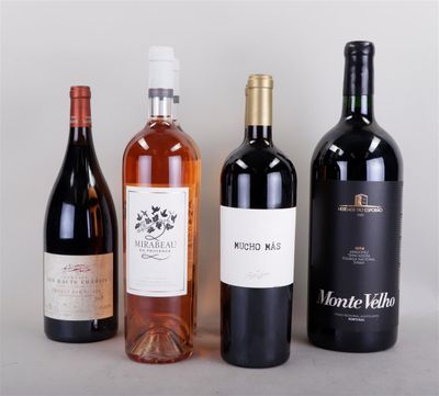 several bottles of wine are lined up on a table