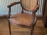 a chair that is sitting on the floor in front of a radiator