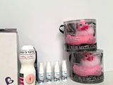 a box of toiletries and a pink toy sitting on a table