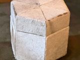 a cube made out of cardboard sitting on the floor
