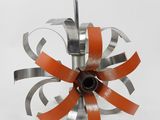 an image of a metal object with a red ribbon on it