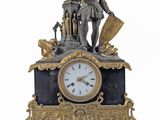 a clock with a statue of a man on top of it