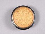 an image of a gold coin on a white surface