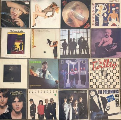 a lot of different album covers on the wall