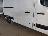 a white van that is parked in a garage