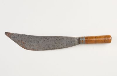 an old knife with a wooden handle on a white surface