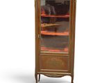 an image of a cabinet with a glass door on top of it