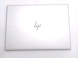a laptop that is sitting on a white table