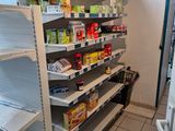 many shelves that have food on them in a store