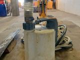 a water pump sitting on the floor in a building
