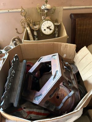 a cardboard box filled with assorted items in a room