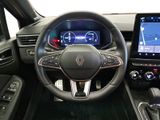 the interior of a car with a steering wheel, dashboard, and touch screen