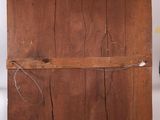 a wooden shelf with a wooden door on top of it