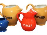 three different types of jugs on the table