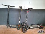 three scooters that are sitting next to each other