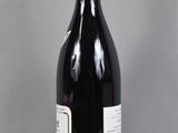 a bottle of wine that is sitting on a table