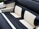 a black and white interior of a car with white trims