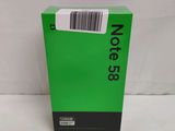 a green box with a barcode on it sitting on a white surface