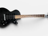 an image of a black electric guitar on a white background