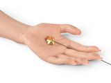 a person holding a needle in their hand and a needle in the other hand