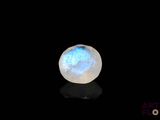 an image of a white and blue glass ball on a black surface