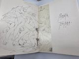 a book with a drawing of a group of people on it