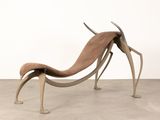 an image of a chair made out of metal and leather