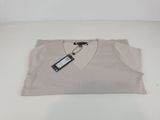 the shirt is white and has a tag on it