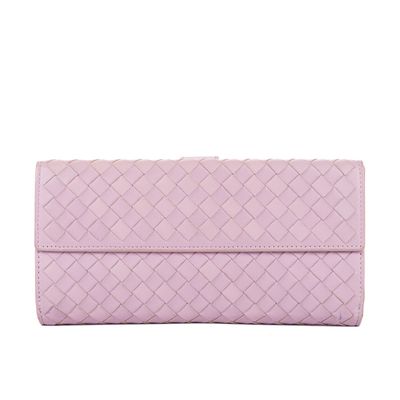 a women ' s wallet with a pink quilting pattern