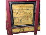 an image of a red and yellow cabinet with a painting on it
