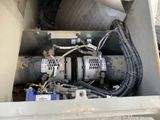 a machine that is sitting in the back of a truck