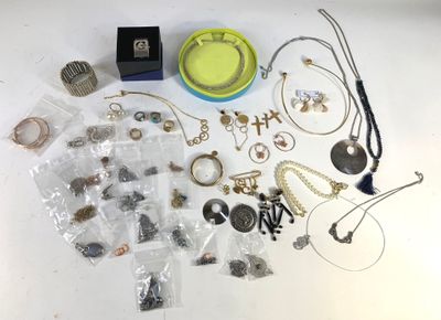 a lot of jewelry that is sitting on a table