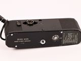 a black camera with a white background and a white background