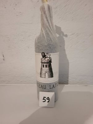a bottle of wine that is sitting on a table