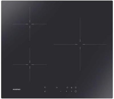 gros plan d'une cuisinière noire à quatre brûleurs