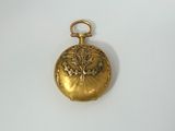 an image of a gold locke with a flower design on it