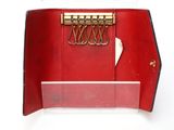 a red purse with a bunch of gold clips in it