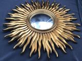 a gold sunburst on a blue table cloth